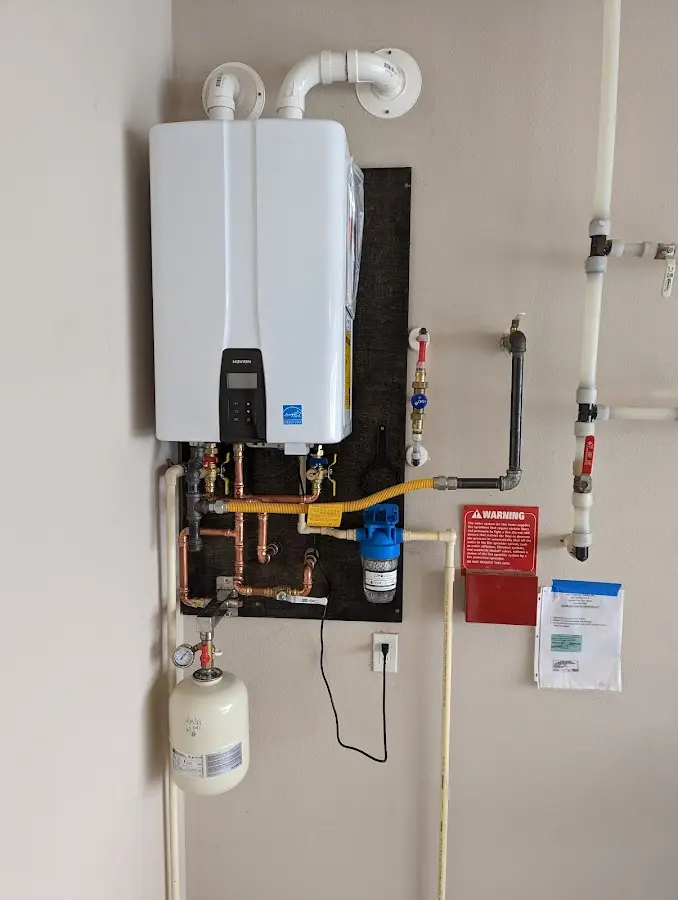 Professional plumber installing copper piping in a Apollo Beach home